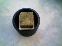 A square piling section fitted through the assembled Pile Saver